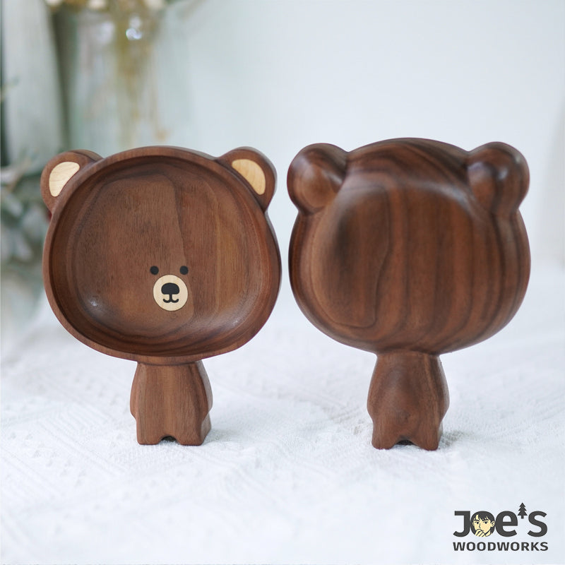 Front and back view of the bear-shaped walnut tray, highlighting its smooth finish