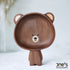 Pipimu Kari Bear hand-carved wooden standing bowl standing upright, showcasing handcrafted walnut grain and charming face