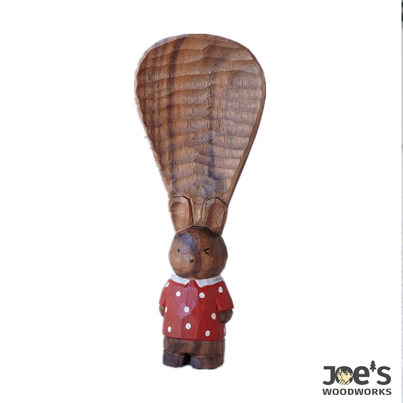 Full view of standing design bunny-shaped rice scoop, hand-painted in red polka dots.