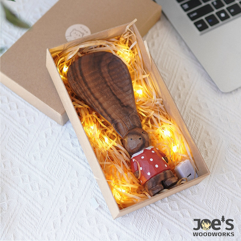 Handcrafted bunny rice paddle in lighted box, ready for gifting.