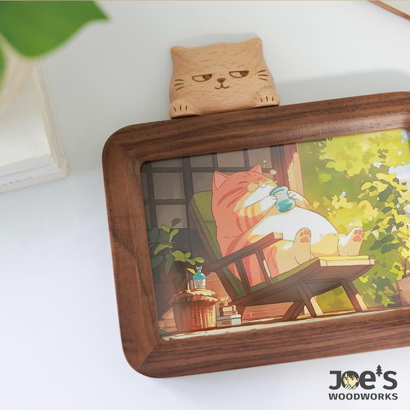 Side view of cat photo frame with colorful cartoon artwork.