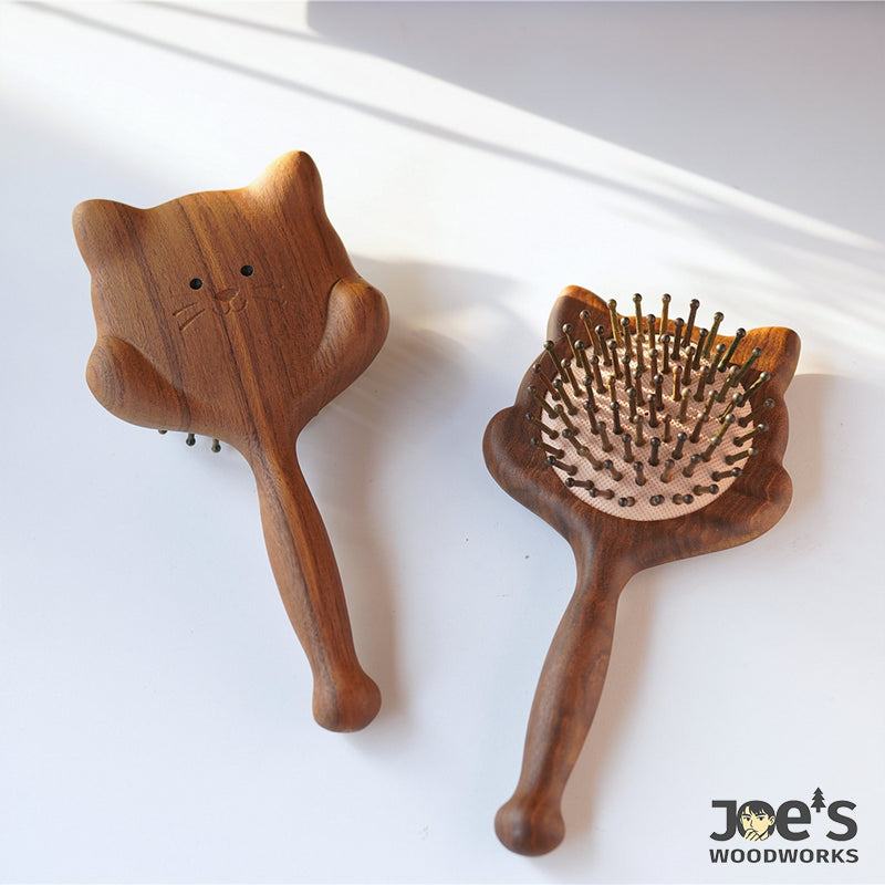 Front and back view of cat-shaped wooden massage brush with cushion bristles