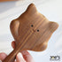 Close-up of cute engraved cat face on wooden massage hair brush