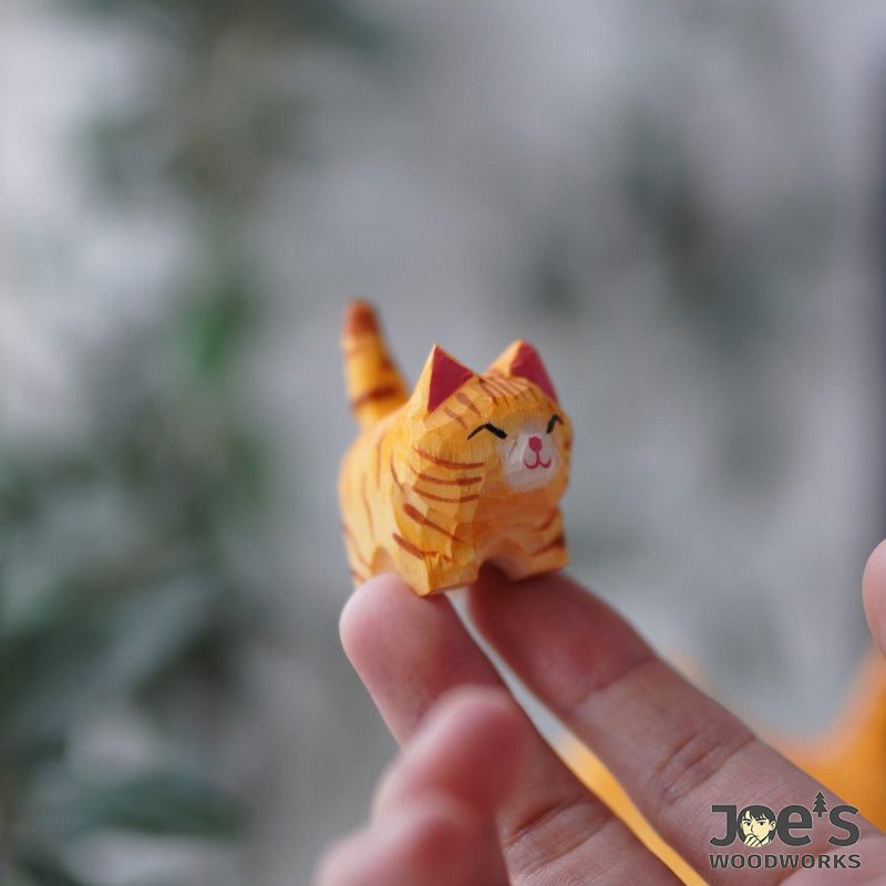 Hand-carved orange cat figurine from Joe&