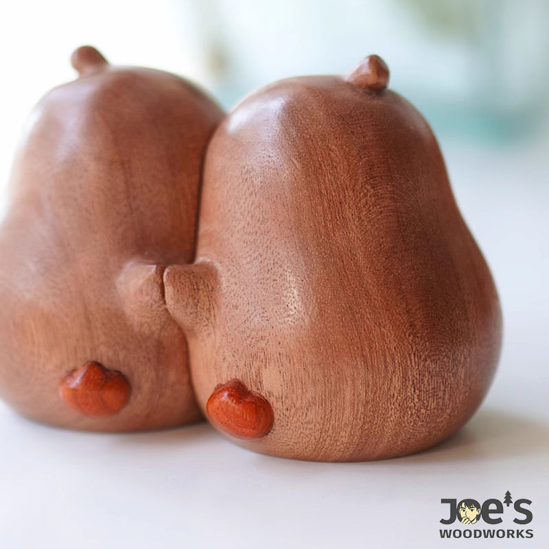 Back Hugs of Wooden Pear Couple Figurines โ Natural Finish Closeup