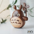 Joeโs Woodworks hand-carved wooden Totoro care cat figure with windmill, made of walnut and maple.