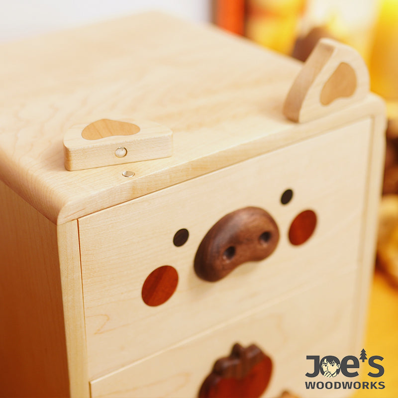 Magnetic removable piggy ears on wooden drawer top