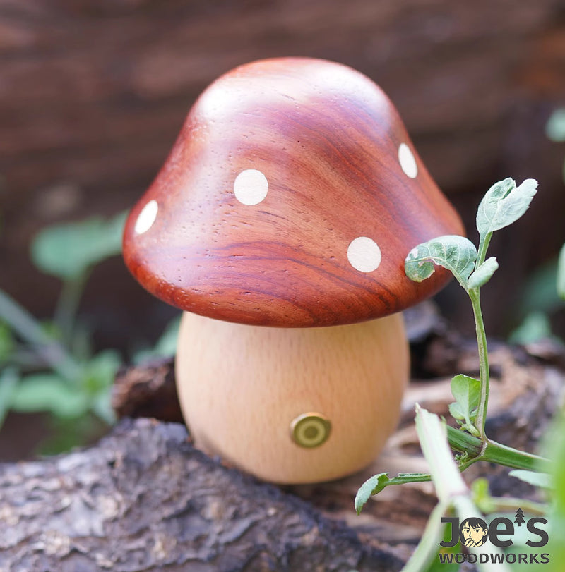 Wooden mushroom lamp placed outdoors on tree bark surrounded by leaves