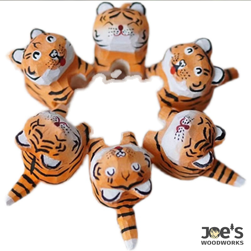 Circle arrangement of small tiger figurines, fun and ideal for wooden decor collections