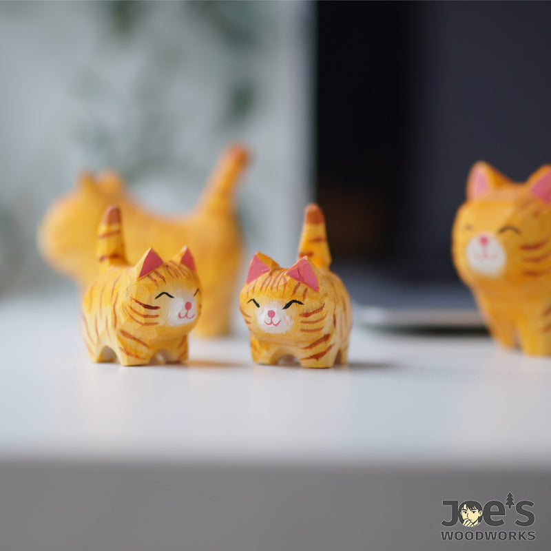 Mini wood cat pair in orange tabby design, perfect for desk or shelf decor