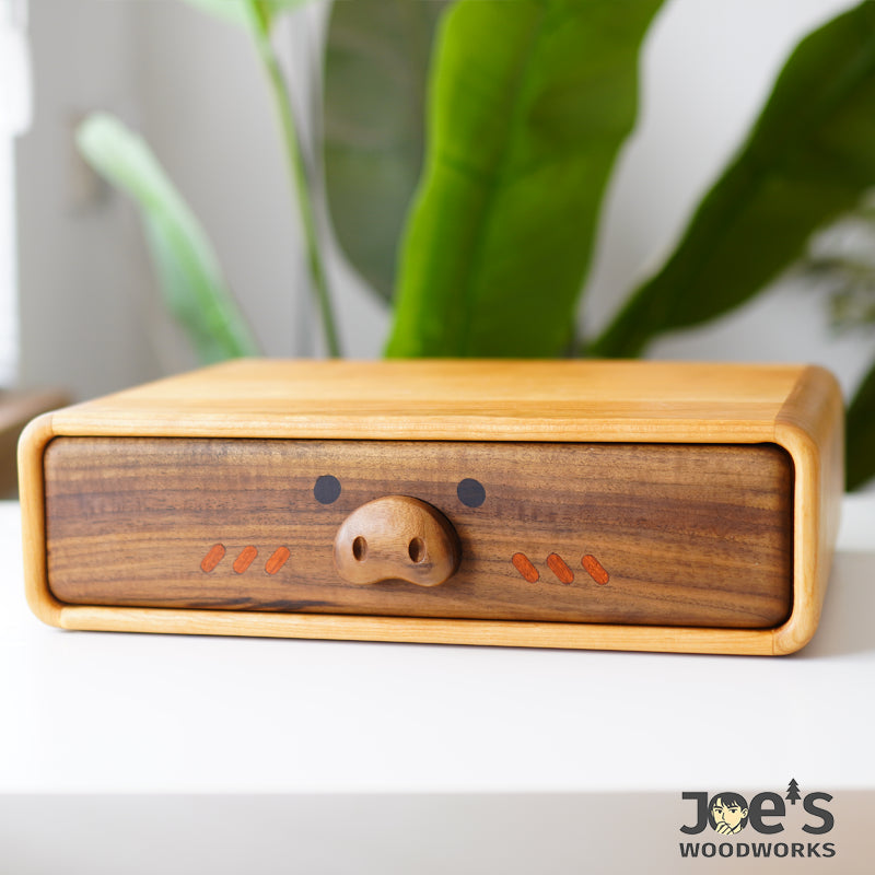Pig face wooden drawer featured in playful mini cabinet for storage