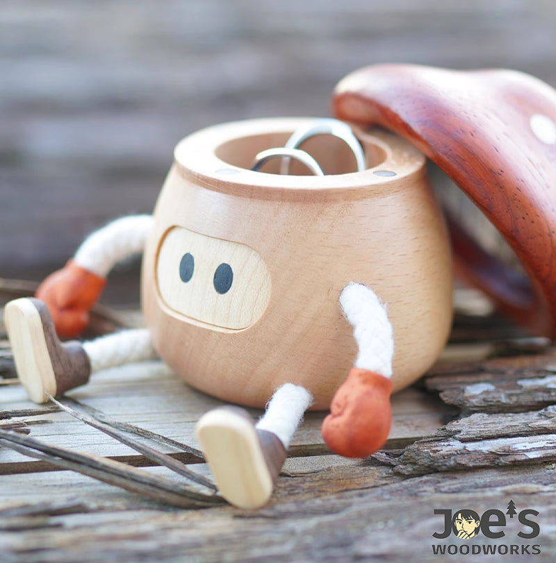 Mushroom-shaped wooden doll decor used as a jewelry holder for rings