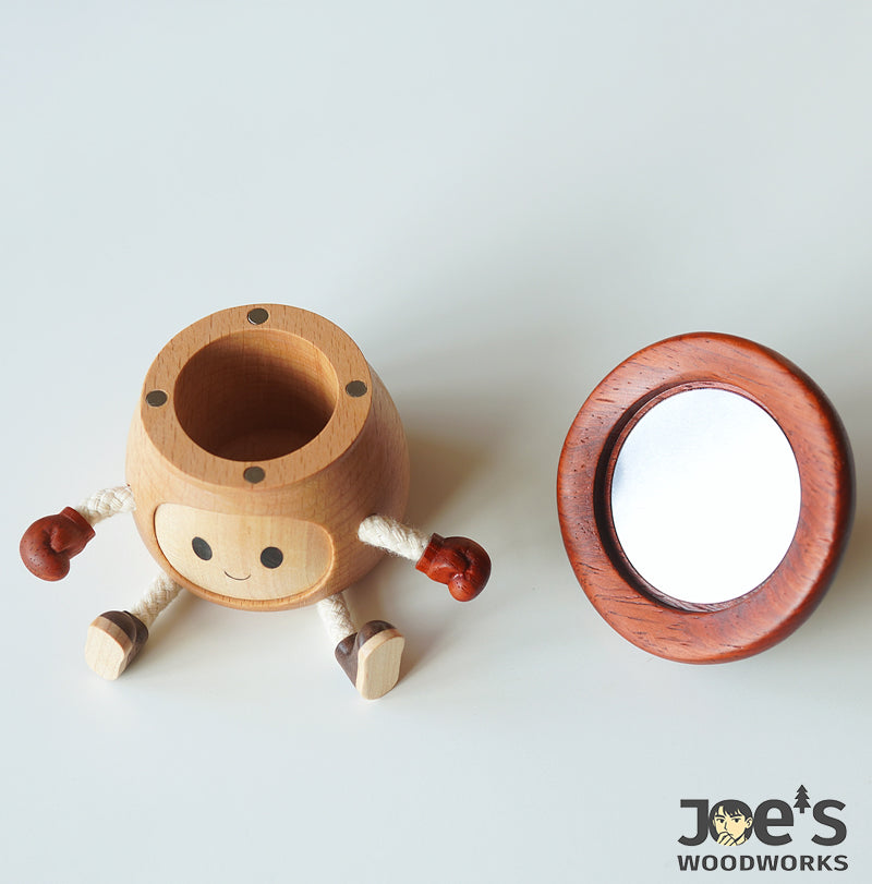 Wooden mushroom doll with separate cap revealing built-in compact mirror