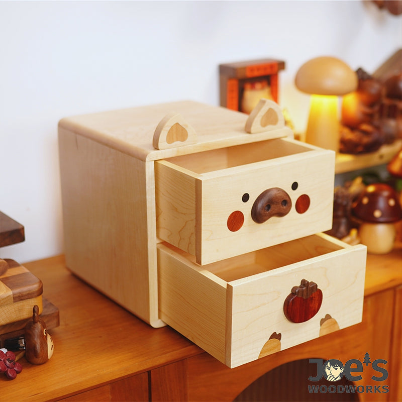 Open drawers of piggy wood cabinet showing interior space