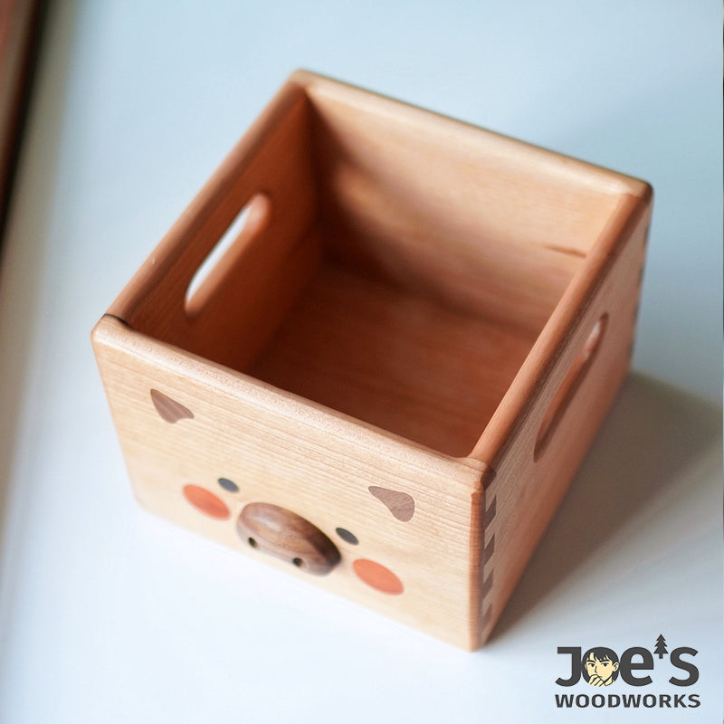 Top-down view showing empty interior of the wooden pig box