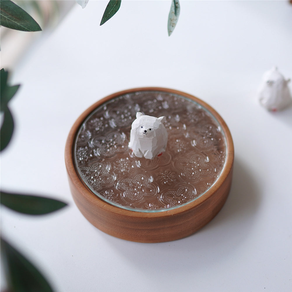 Top View of Pipimu Bear Jar with white bear figurine on walnut wood and glass lid