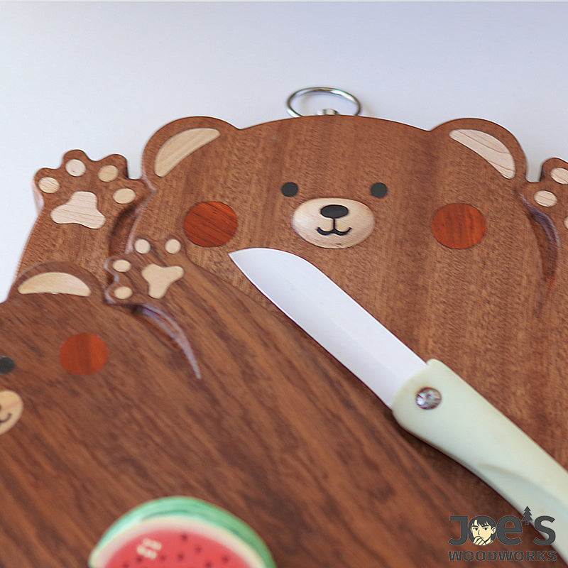 Chopi Bear wooden cutting board used for fruit and snacks in a cozy kitchen