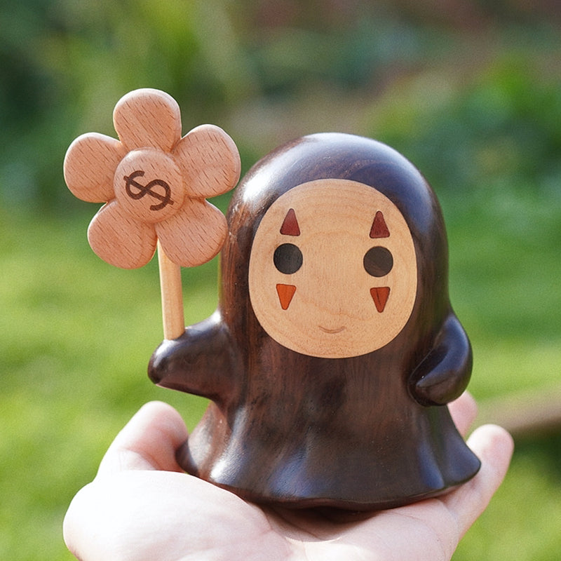 Nordic-style Mori Forest Spirits wooden figurine, artisan carved with lucky coin design in hand.