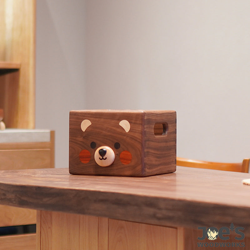 Side view of Pipimu Hako Bear wooden box showing bear-face inlay