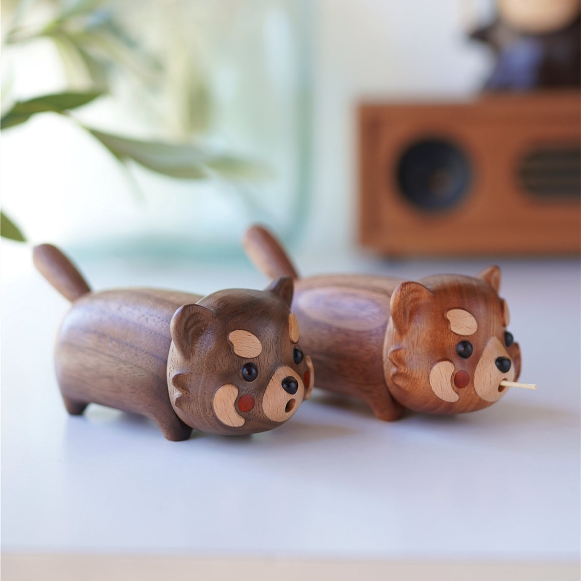 Two Poco wooden cat toothpick holders in different wood tones