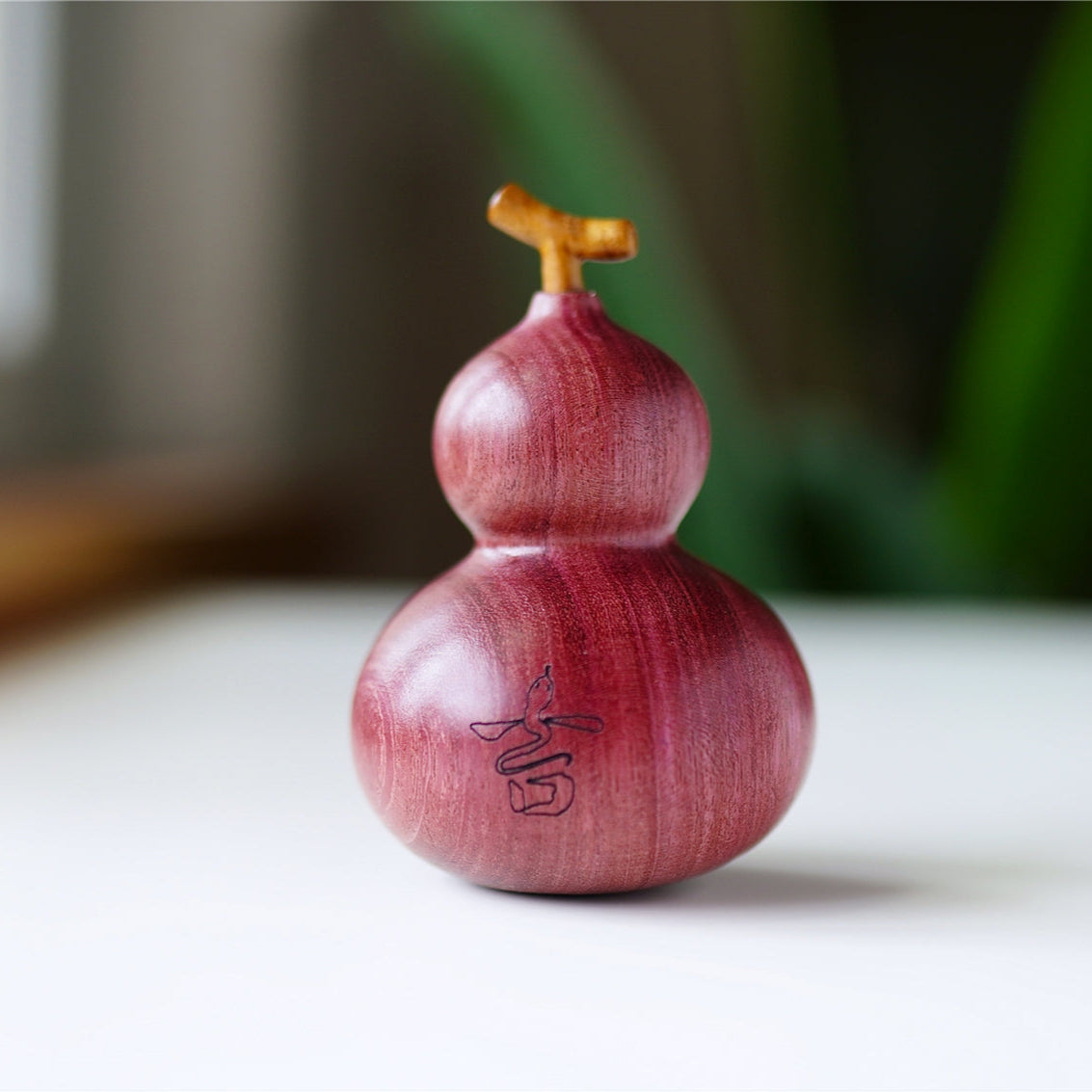 Pipimu Lucky Gourd back view, handmade purpleheart wood figurine, natural home accent