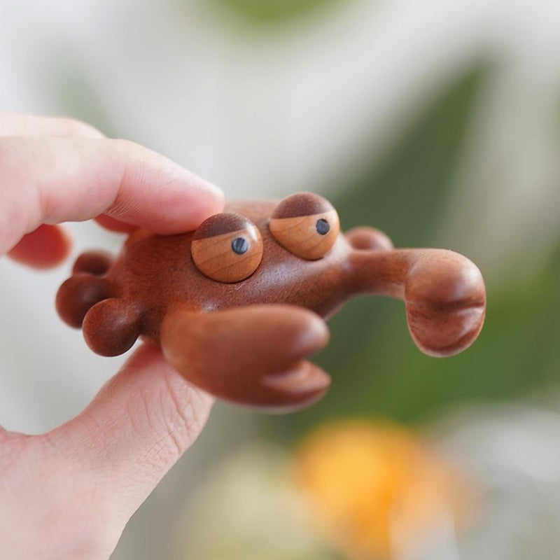 Natural wood crab massager for neck, shoulder, and back tension relief.