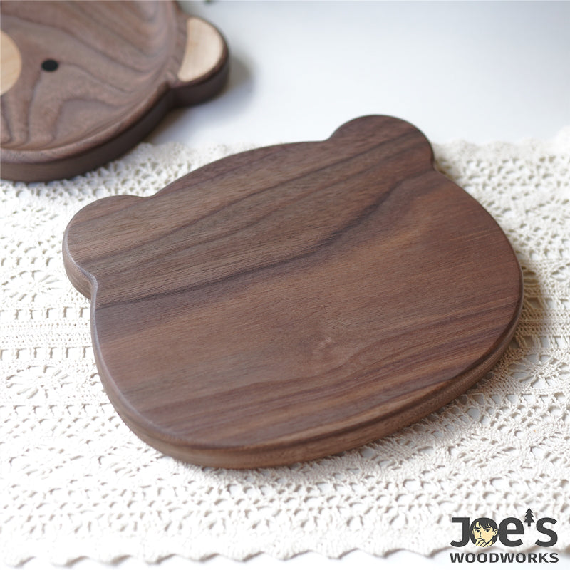 Backside view of smooth finished walnut nomi bear plate from Pipimu