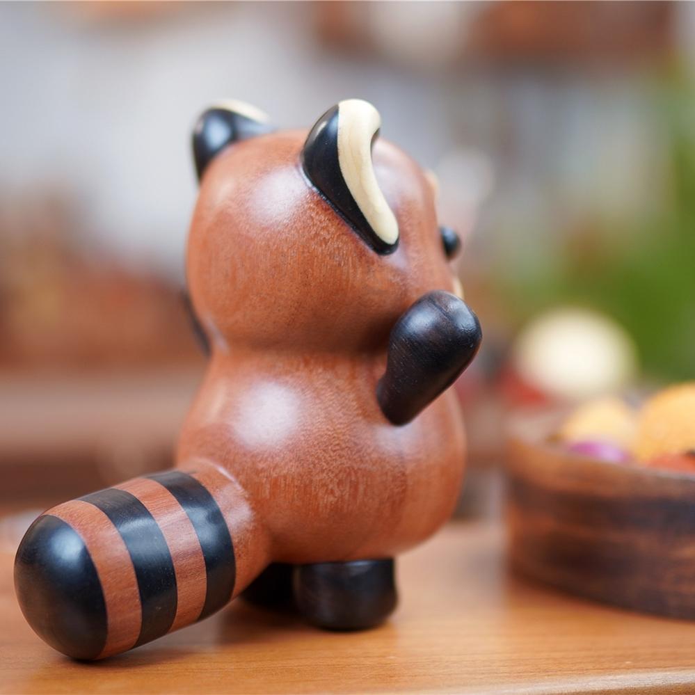 Back view of red panda wood carving, pipimu decor