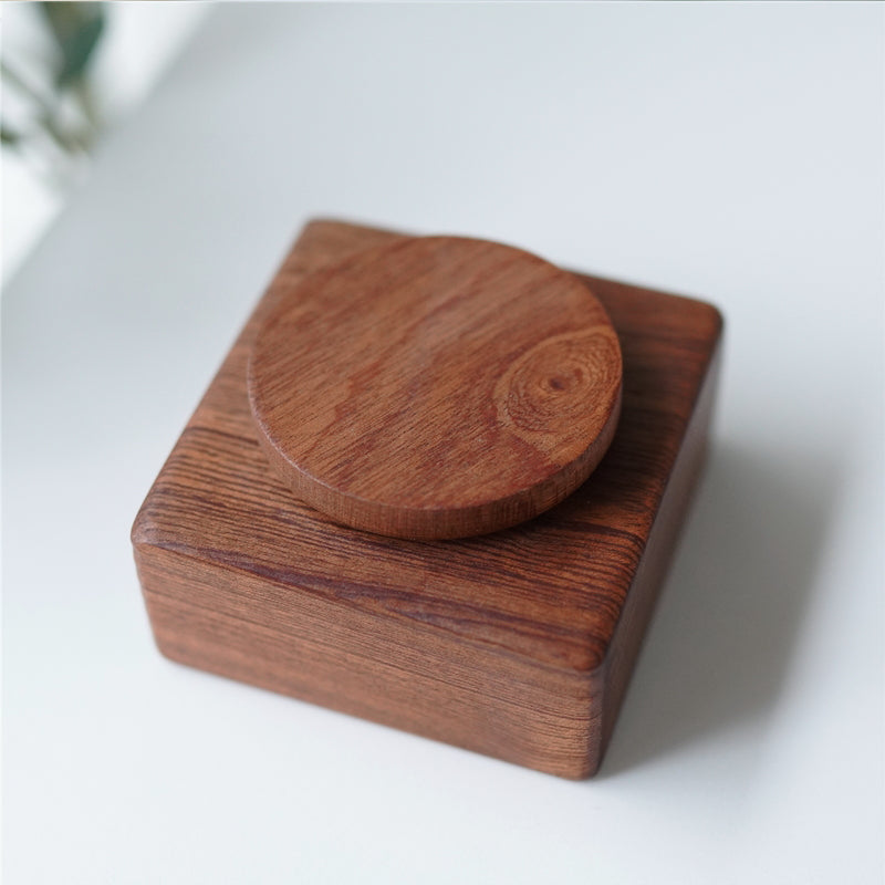 Pipimu wooden music box base close-up showing natural ebony wood grain