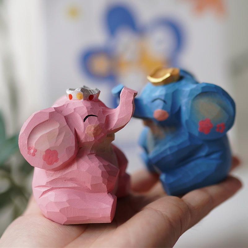 Pipimu Woodland Family Ella & Enzo wooden elephant figurines in hand