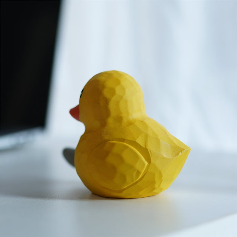 Back view of yellow duck wood carving figurine