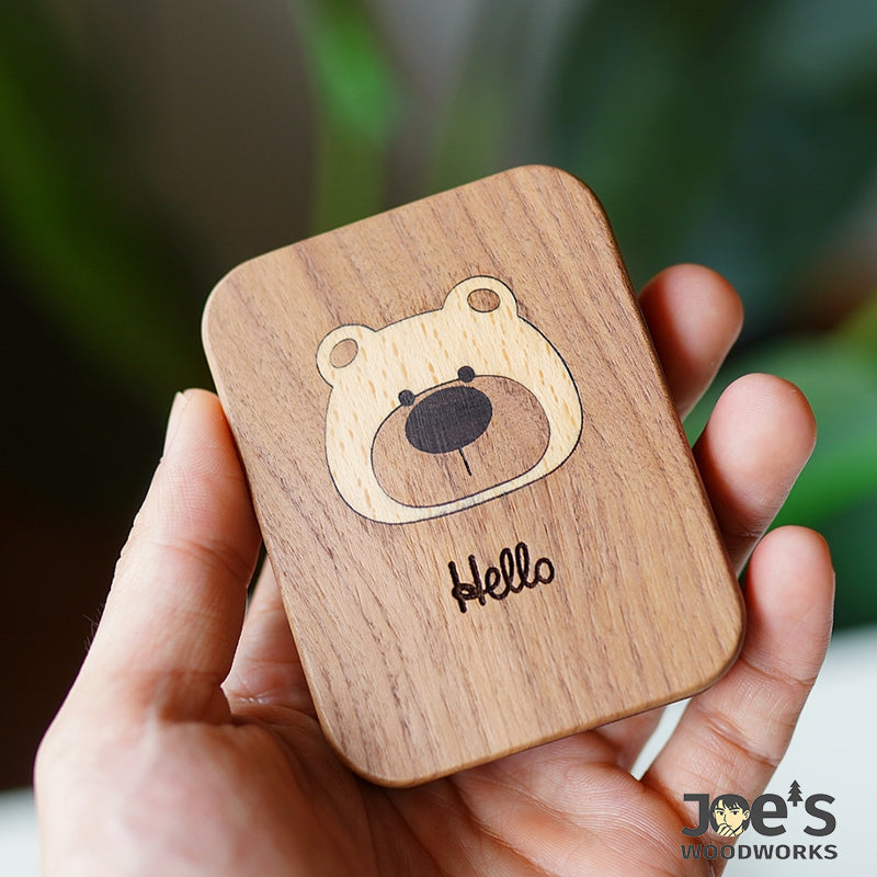 Wooden mirror held in hand