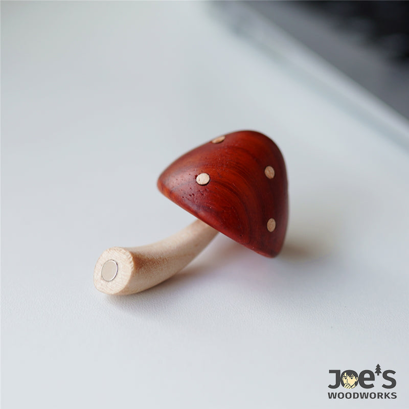 Natural wood mushroom magnet with curved stem and red cap, perfect for fridge decor