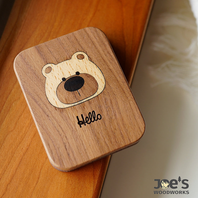 Bear mirror on wooden surface