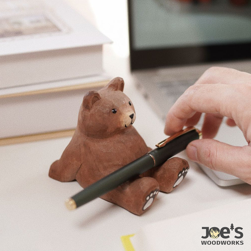 Multifunctional wooden bear used as pen holder on office desk