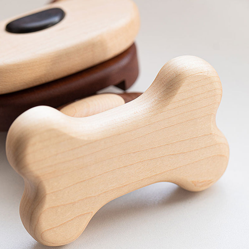 Detail shot of wooden dog phone stand with smooth finish