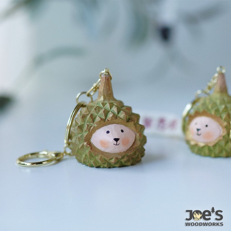Set of hand-carved durian animal wood keychains with cute faces