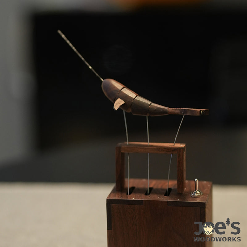 Side angle of handcrafted whale automaton in motion