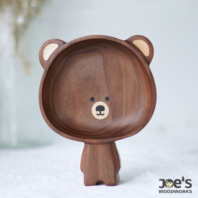 Pipimu Kari Bear hand-carved wooden standing bowl standing upright, showcasing handcrafted walnut grain and charming face