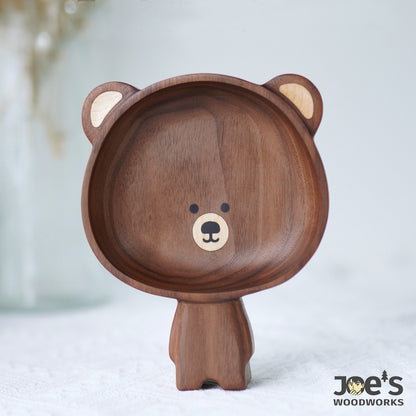 Pipimu Kari Bear hand-carved wooden standing bowl standing upright, showcasing handcrafted walnut grain and charming face