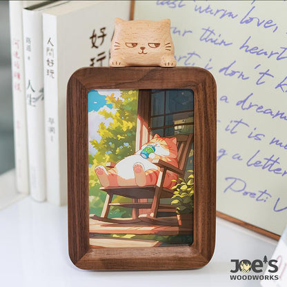 Wooden photo frame with sleepy cat topper, handcrafted by Joe’s Woodworks.