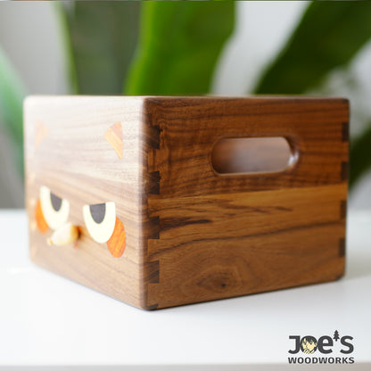 Side detail of walnut cat tissue box showing dovetail joints