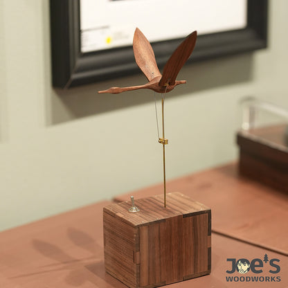 Wooden swan kinetic sculpture as elegant home decor