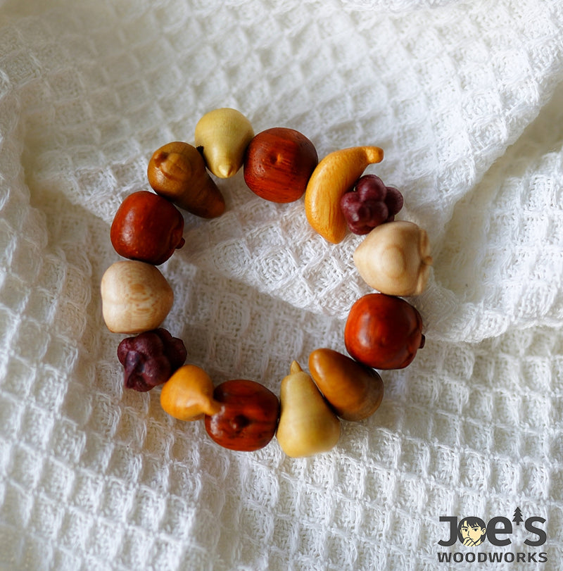 Joeswoodworks handcrafted fruit charm bracelet made from natural wood beads