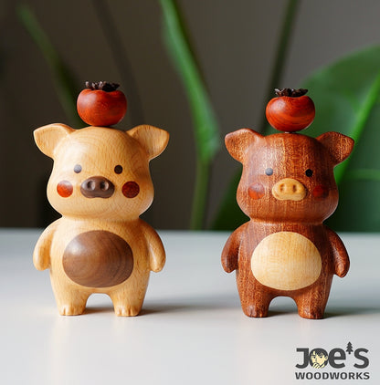 Pair of wooden pig figurines with persimmon fruits on heads, handmade gift decor