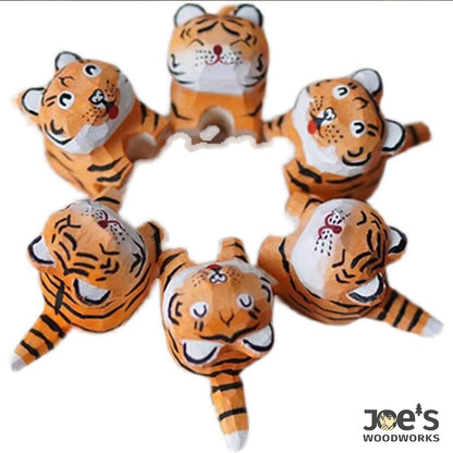 Circle arrangement of small tiger figurines, fun and ideal for wooden decor collections