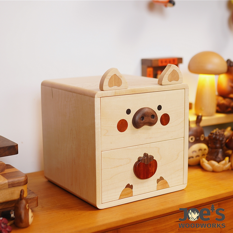 Side angle view of the piggy wooden mini storage cabinet