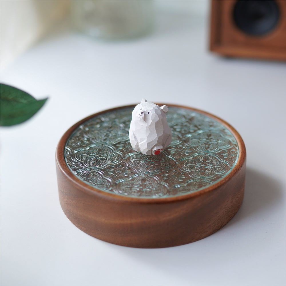 Side view of Pipimu Bear Jar with white bear figurine on walnut wood and glass lid