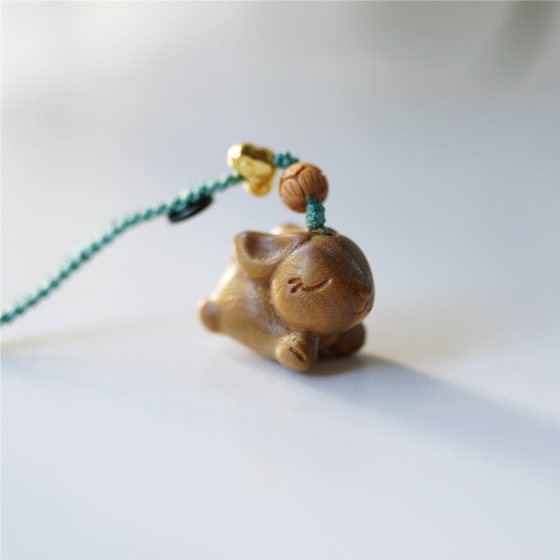 Handmade Pipimu Bunny Dash pendant with natural wood finish