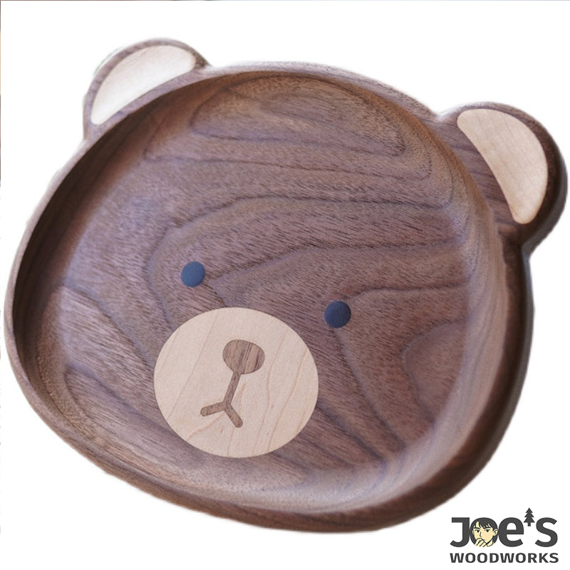 Pipimu Nomi Bear hand-carved wooden plate front view with bear face design